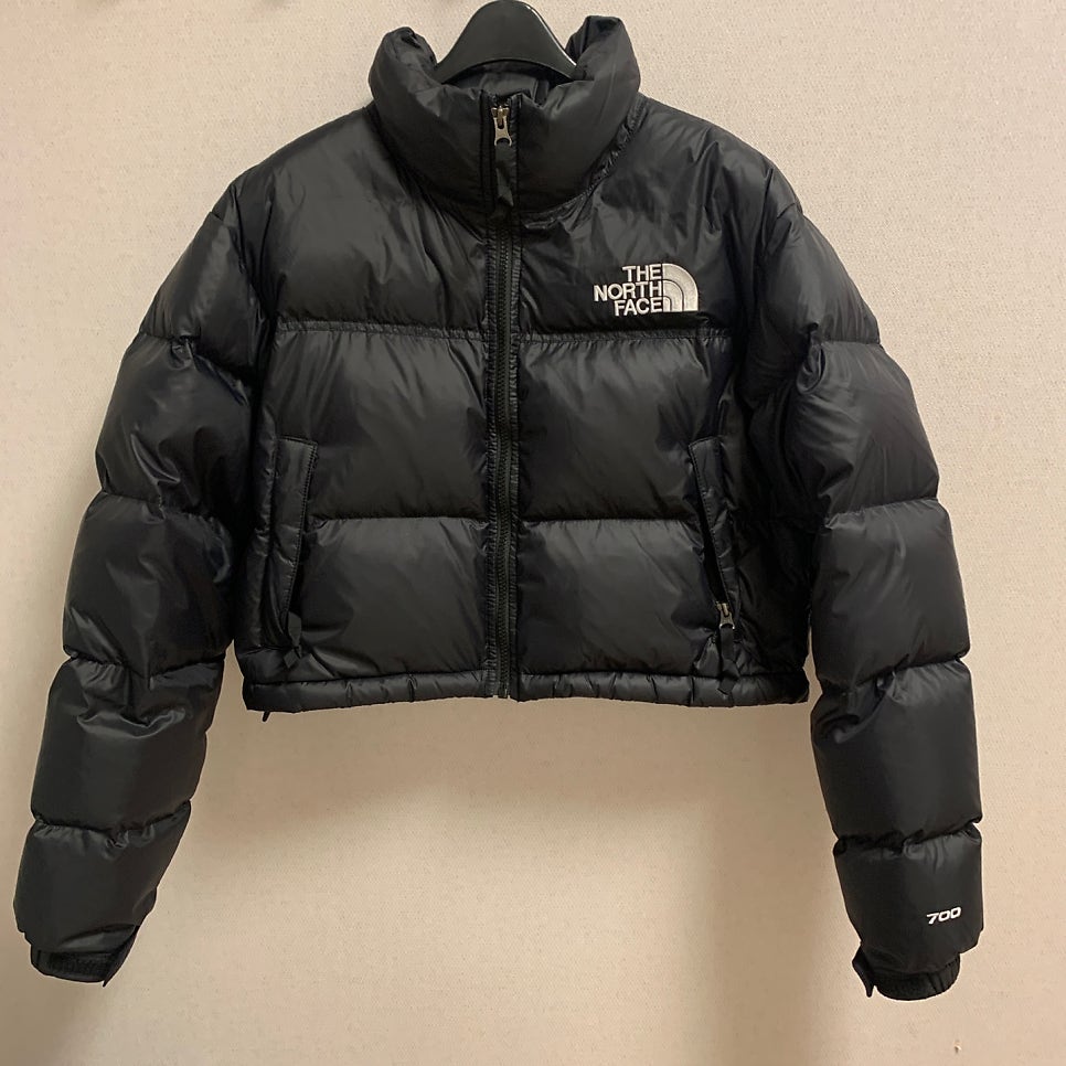 the north face nuptse short jacket black front view real photo showing matte texture