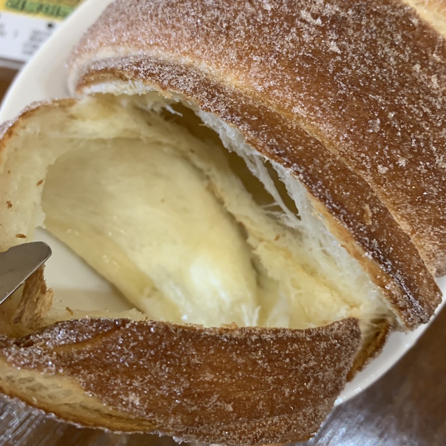 Close-up showing crispy and soft texture of a Seokchon Lake dessert chimney cake