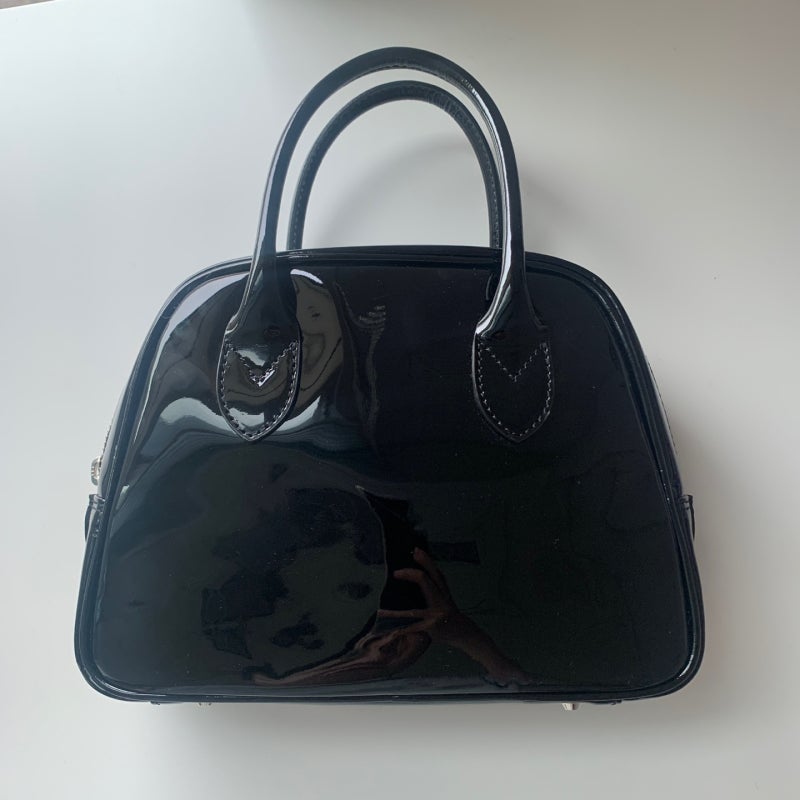 front view of the comme des garcons aoyama bag enamel