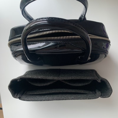 top opening of comme des garcons aoyama bag with organizer