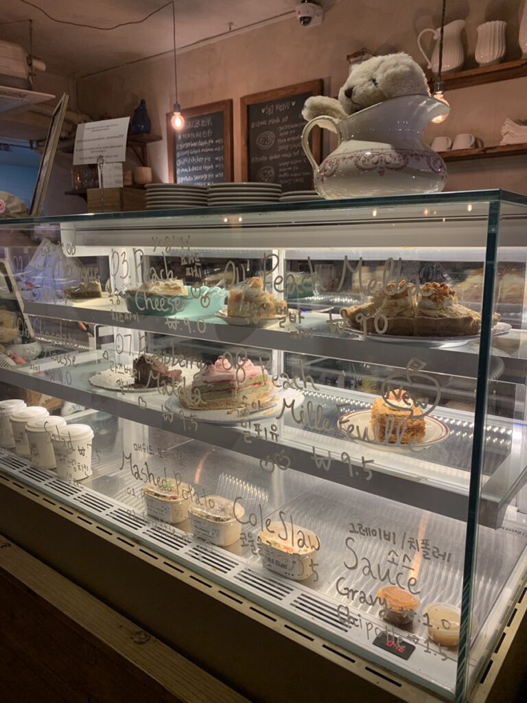 Cake display case at a Songridan-gil Jamsil dessert cafe