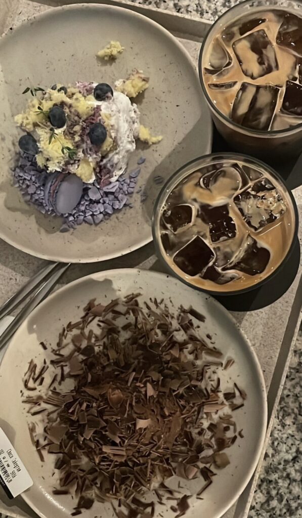 Blueberry and chocolate Cakegram on cafΓ© table