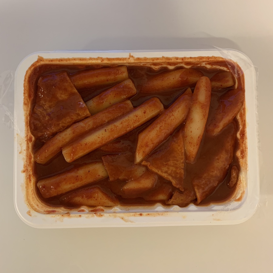 Take-out container filled with Seokchon Station tteokbokki and Busan fish cakes from Jagalchi Busan Eomuk