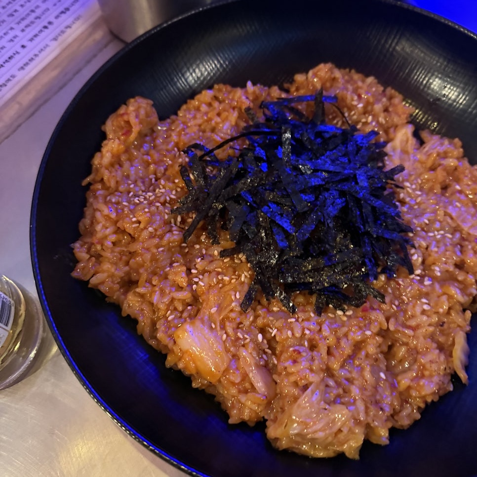spicy fried rice mixed with chicken stew sauce, topped with seaweed flakes