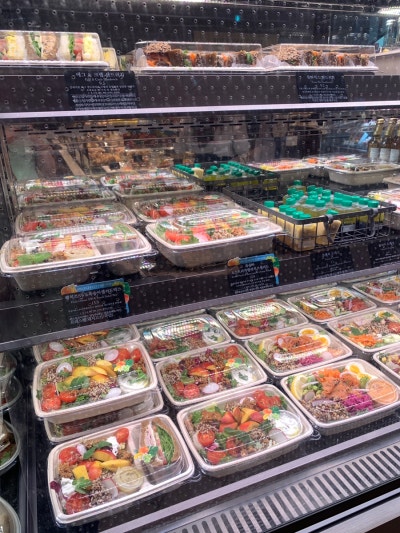 Fresh salad selection at Paris Croissant Gangnam Station displayed in clear containers