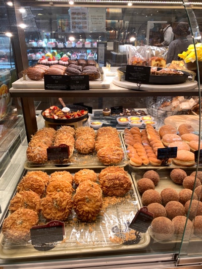 Savory bread items including croquettes displayed at Paris Croissant Gangnam Station bakery counter