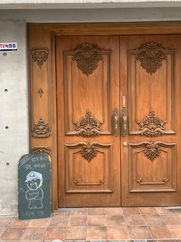 Wooden entrance with European-style double doors at Cafe Root Gangnam