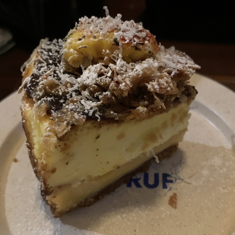 Close up of corn crumble cheesecake texture at Bukchon dessert cafe near Anguk Station Seoul