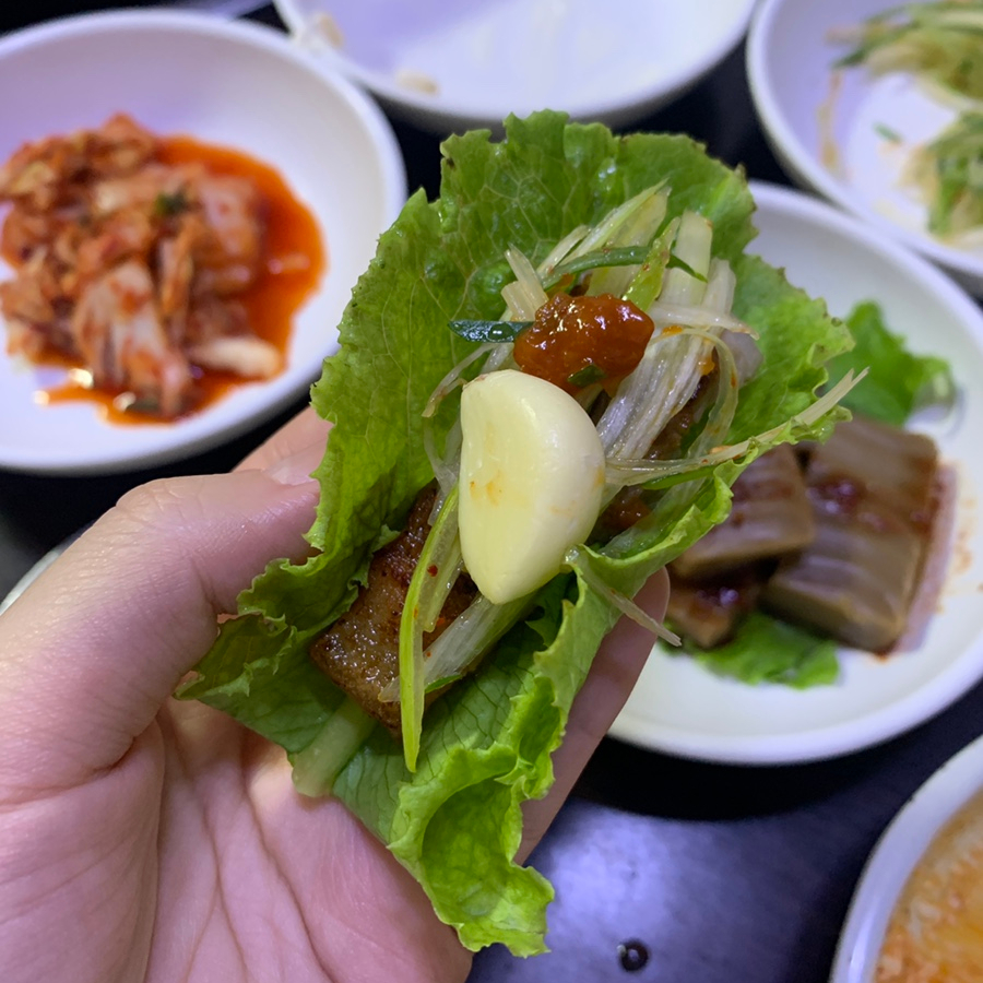 Korean ssam with pork belly and garlic at a Bukchon Korean Restaurant