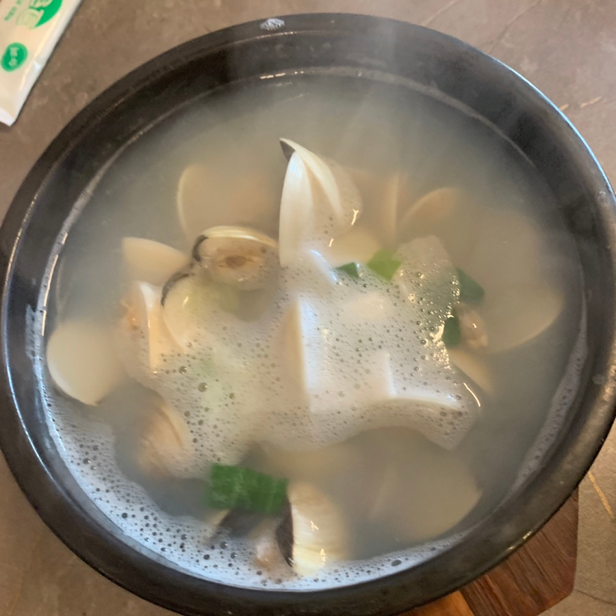 Hot clam soup with fresh clams served at a Hyehwa Korean restaurant