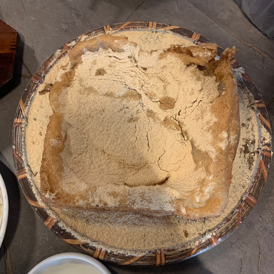 Crispy grilled injeolmi rice cake at a Hyehwa Korean restaurant, coated in soybean powder