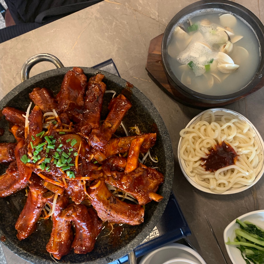 Spicy pork ribs set with udon and clam soup at a popular Hyehwa Korean restaurant