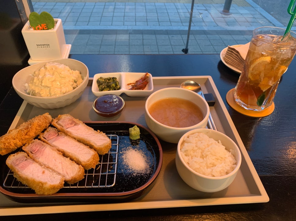 Close-up view of Seokchon Station Tonkatsu with crispy pork loin texture