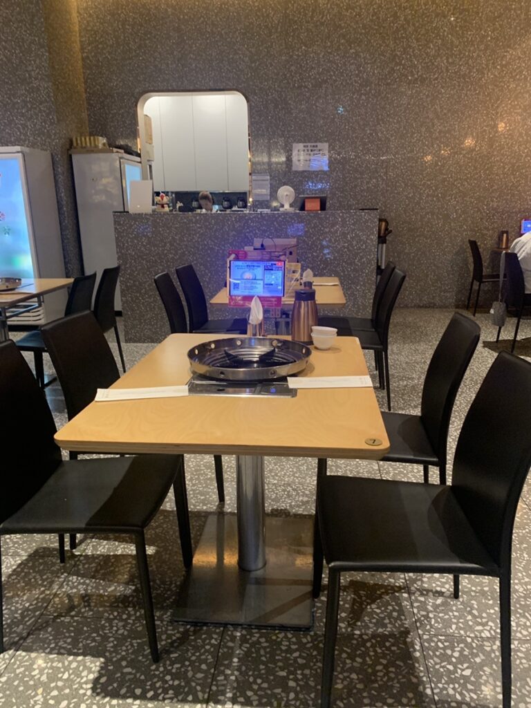 : Interior seating of Jikang Hansikdang Jamsil with table grill