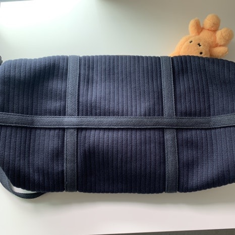 Cylindrical silhouette of the Glowny x Simihaze Cotton Pillow Bag in navy