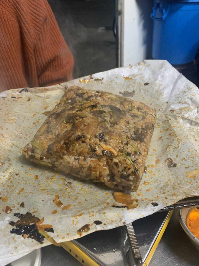 Kimchi fried rice pressed into a square after Seoul Forest frozen pork belly