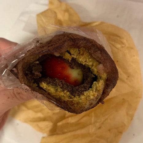 Strawberry Dubai mochi cross section showing fresh strawberry and chewy glutinous rice cake