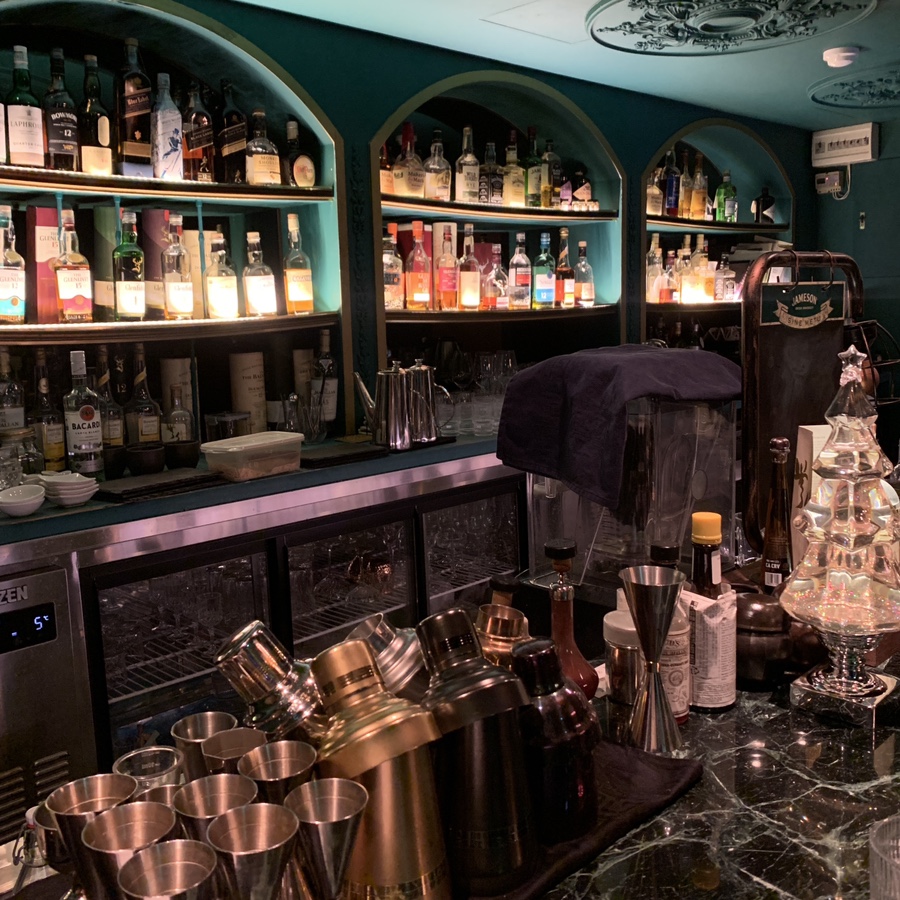Interior bar counter with spirits and warm lighting at Ferry Tail in Gangnam Seoul