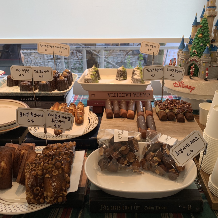 Dessert display with financiers and madeleines at Upper and Under Gangnam