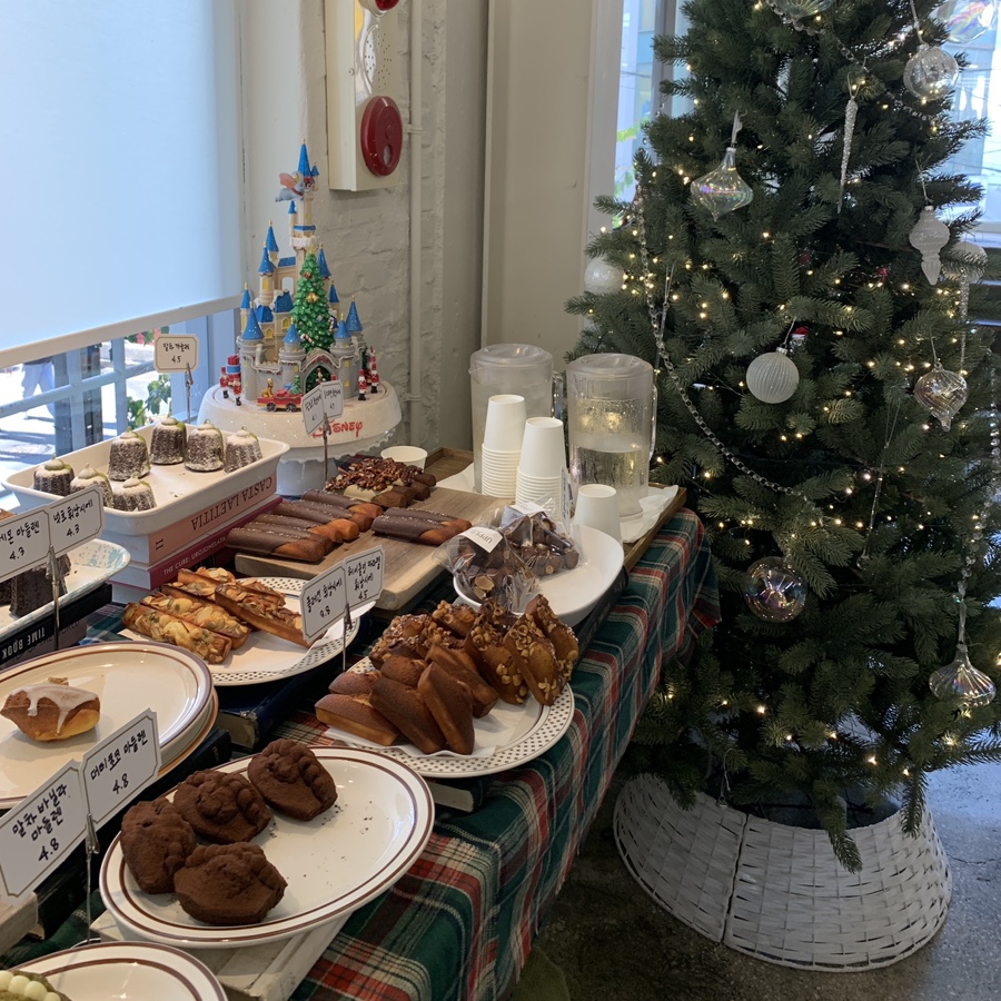 Various baked desserts including canelés at Upper and Under dessert cafe