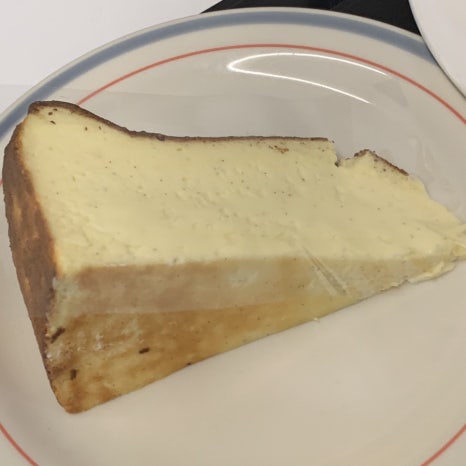 Creamy cheesecake slice with coffee at Gangnam cheesecake cafe Upper and Under