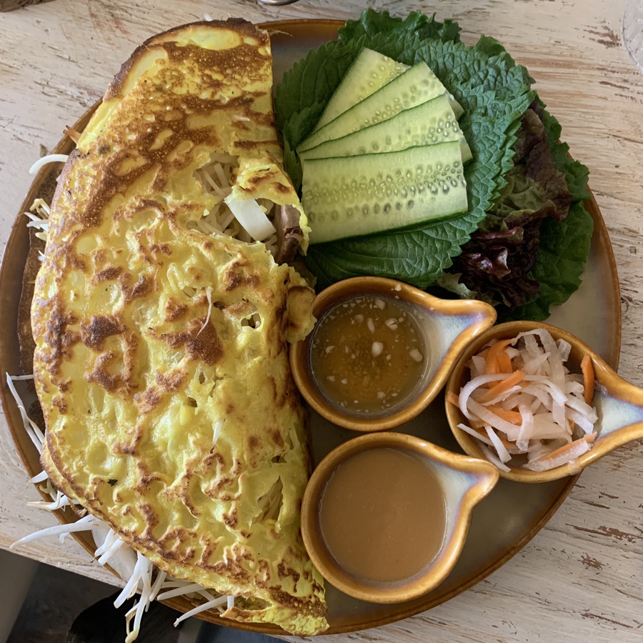 Vietnamese banh xeo served with herbs and dipping sauce at Pho U Seongsu