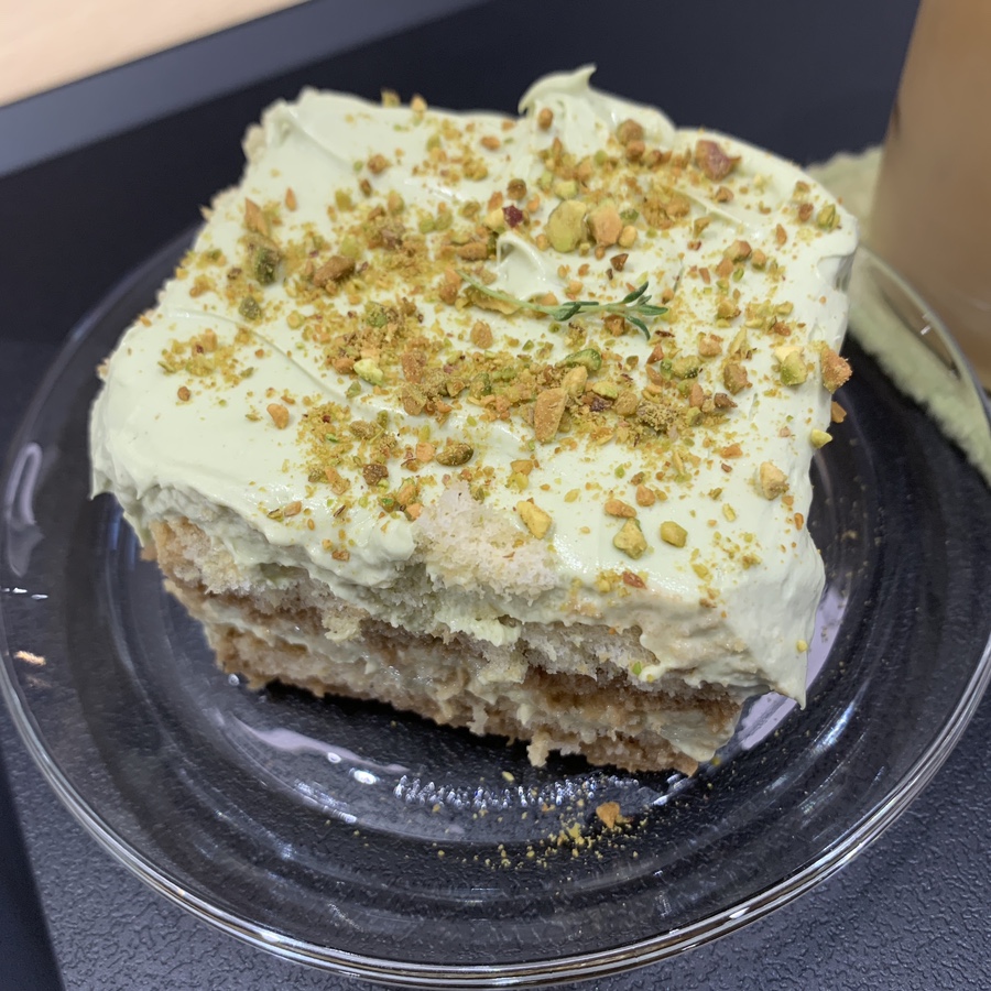 Pistachio tiramisu topped with crushed pistachios at Howp Songridan-gil Cafe