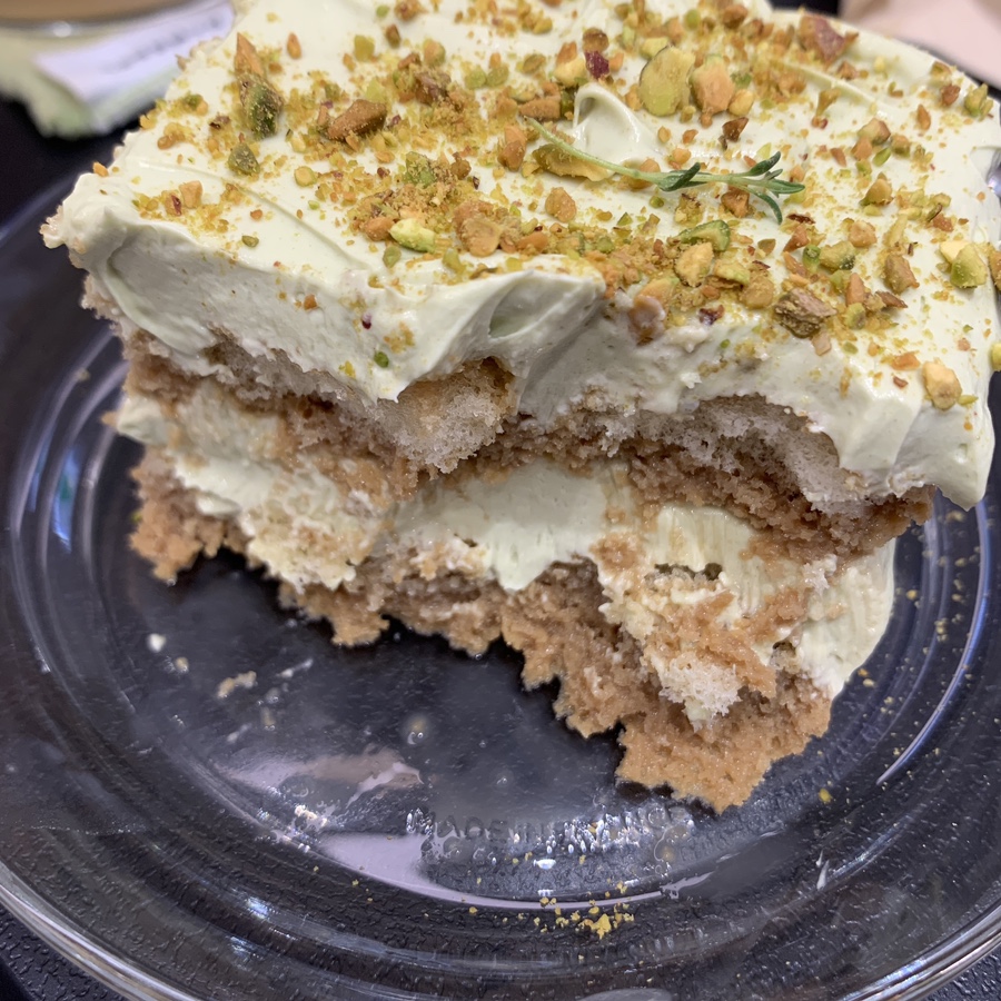 Pistachio tiramisu cross section showing light cream and sponge layers at Howp Songridan-gil Cafe