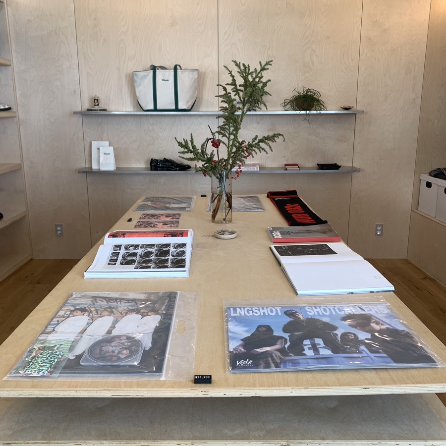 Dosan Park Waste Store Cafe curated table with books and vinyl records