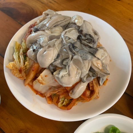 Euljiro oyster bossam with fresh oysters and kimchi at Incheon Jip