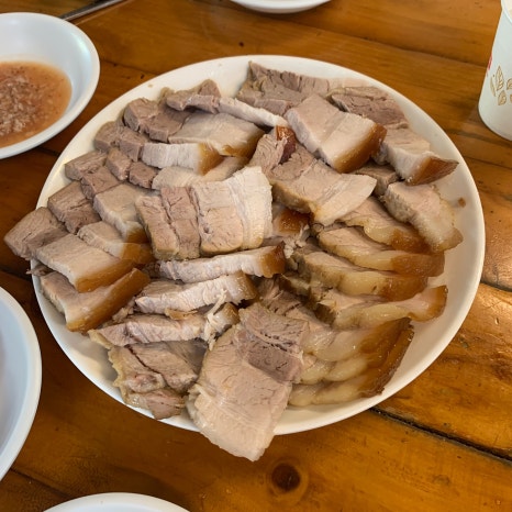 Sliced pork bossam plate served with oyster kimchi in Euljiro