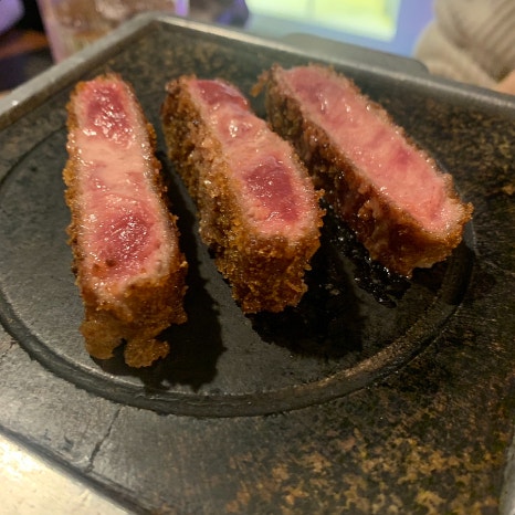 Gyukatsu grilling on a charcoal stove at Sinsa Garosu-gil restaurant Furato Shokudo