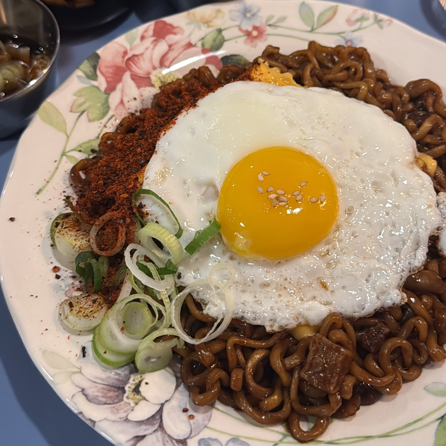 Spicy jjapagetti with egg and cheese at Shinnonhyeon Station oden bar