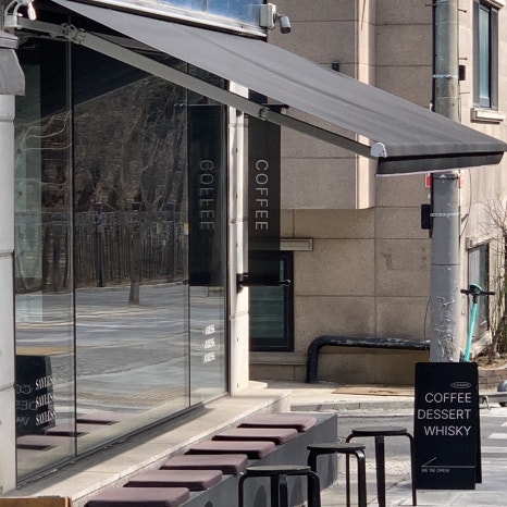 outdoor terrace seating at sayless cafe near seolleung royal tombs seoul