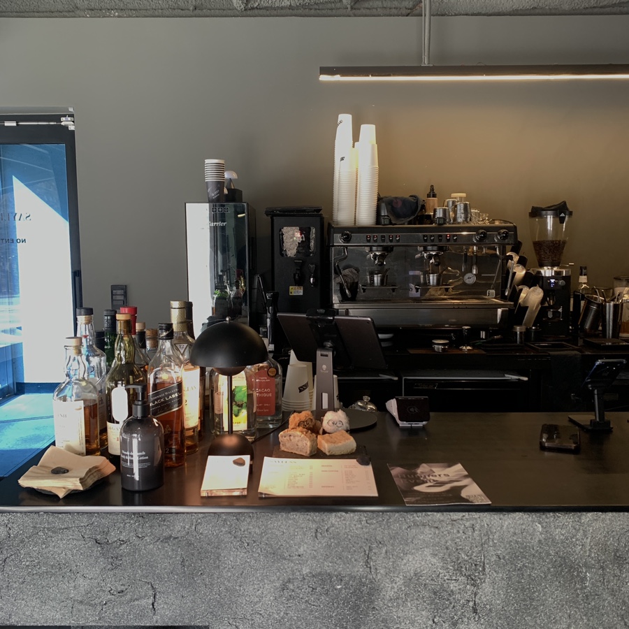 bar counter with whiskey bottles at sayless cafe near seolleung royal tombs