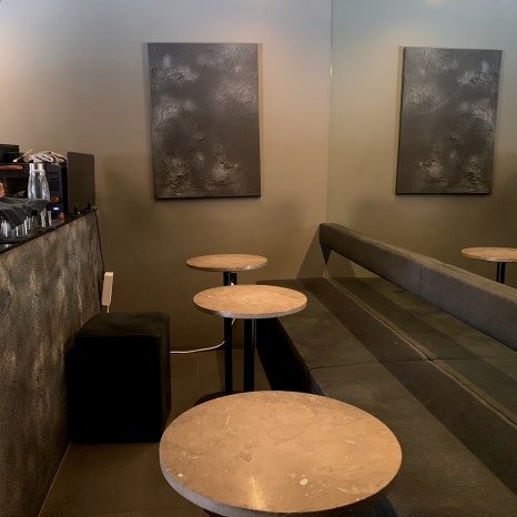 minimal black interior seating at sayless cafe near seolleung royal tombs