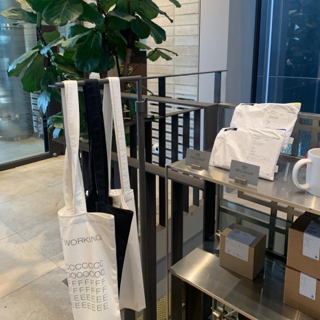 Maxim Plant cafe tote bags and coffee goods display Hannam