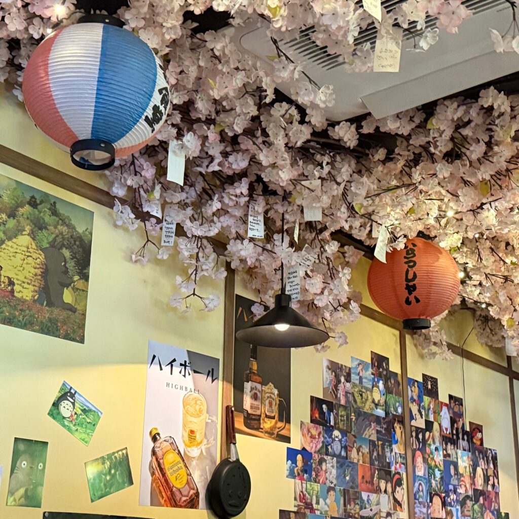 anime izakaya mekkiya interior with anime figures and decorations