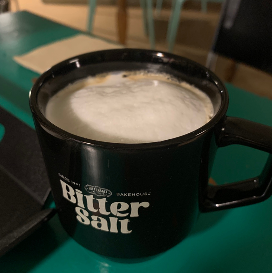 Bitter Salt Cafe latte in black mug Songridan-gil Jamsil cafe