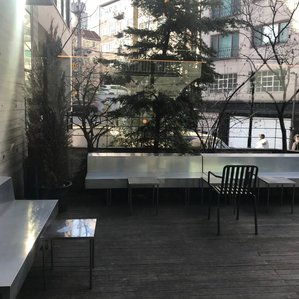 mtl hyochang cafe exterior concrete wall outdoor seating