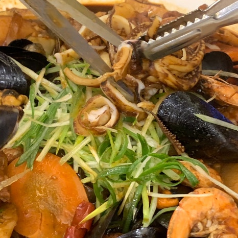 seafood Seoul Express Bus Terminal jjimdak with shrimp squid and mussels close up