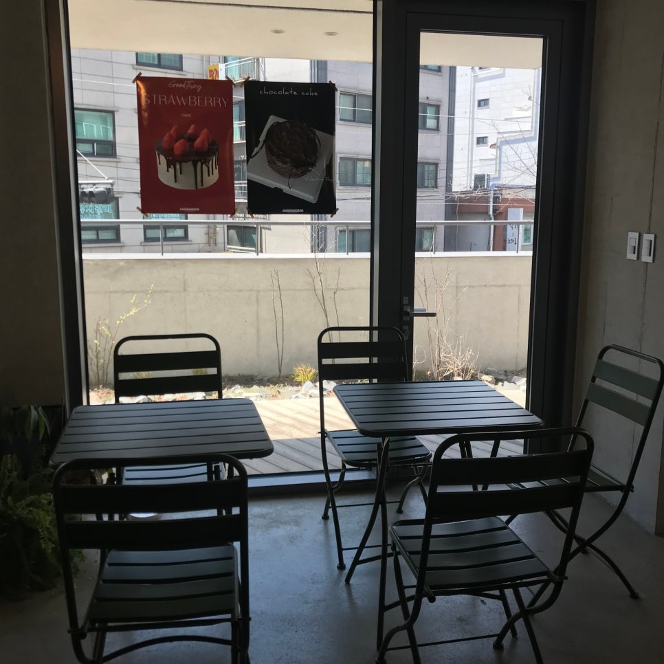 achasan station cafe terrace seating window natural light