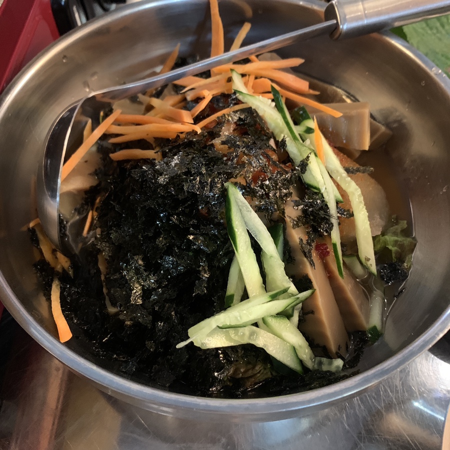korean muksabal cold soup with acorn jelly and vegetables