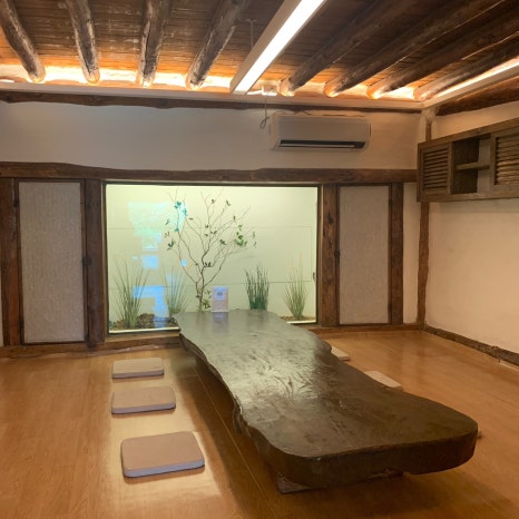 hanok style cafe interior wooden beams Bali Garden Ulsan
