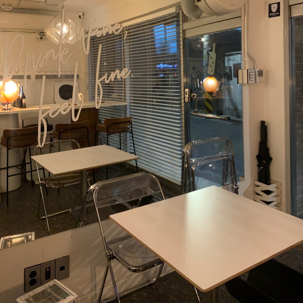NOSE wine bar interior table seating cozy window view Seoul