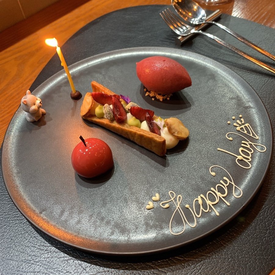 Michelin restaurant Seoul cherry dessert with happy day message and candle