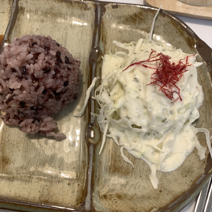 Purple rice and cabbage salad served at Garosugil Pork Cutlet restaurant