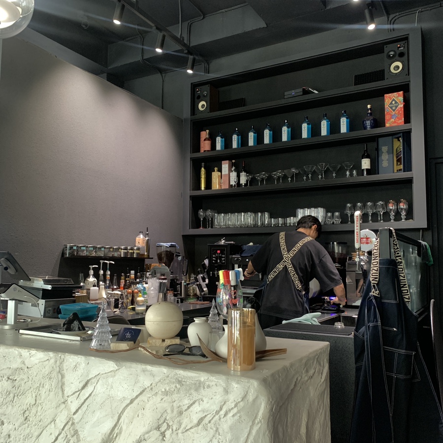 modern black toned interior at Day None cafe