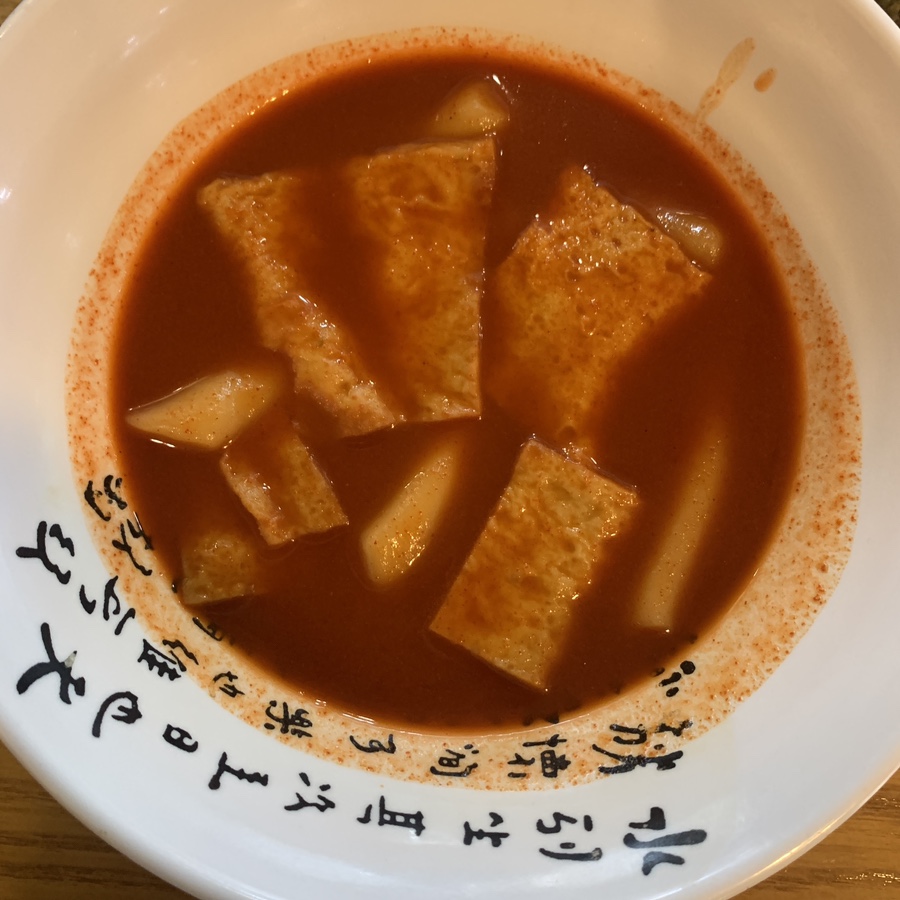 Spicy Korean tteokbokki with fish cakes near Suseo Station