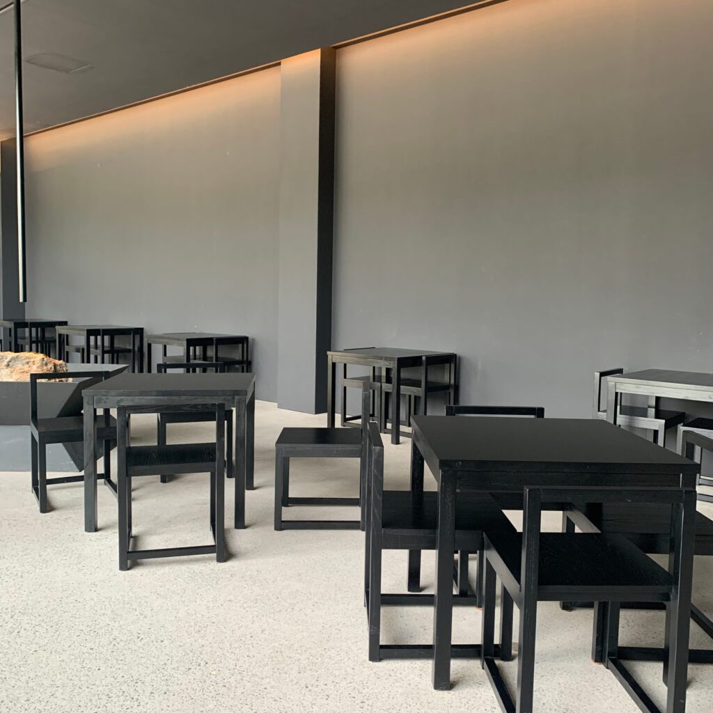 Black interior seating area at Mukri459 Ulsan cafe